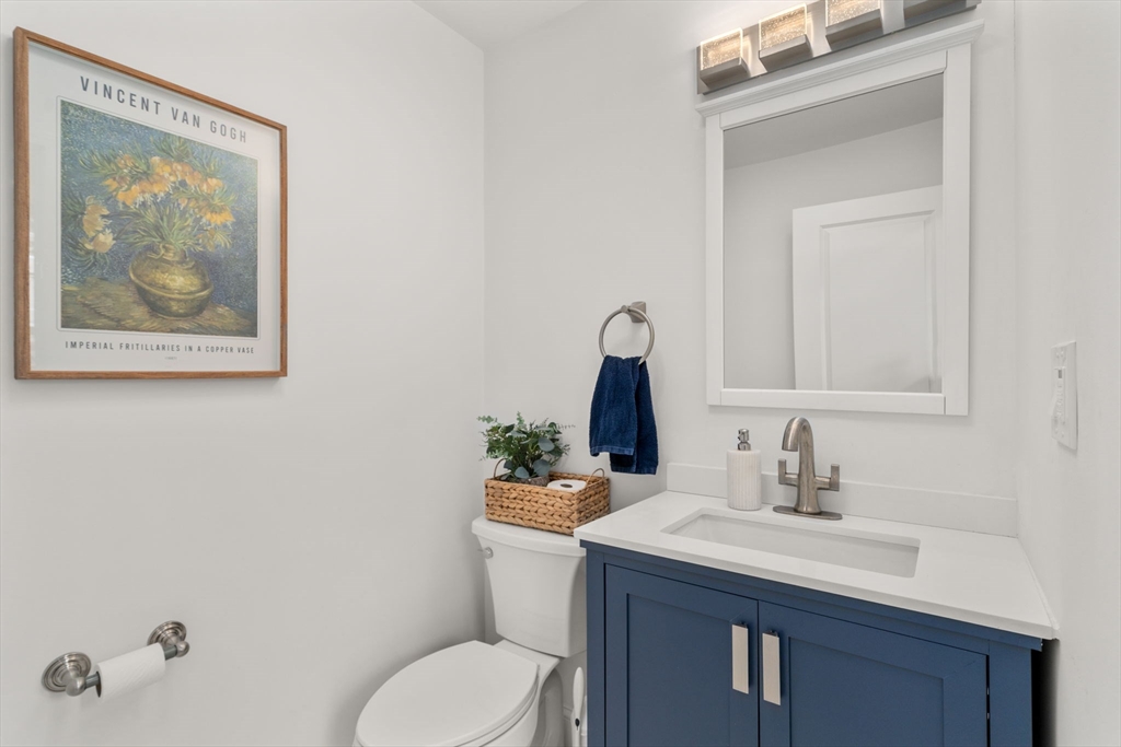 6 Ash Street Natick, MA 01760 - Photo 14 of 39 a bathroom with a toilet sink and mirror