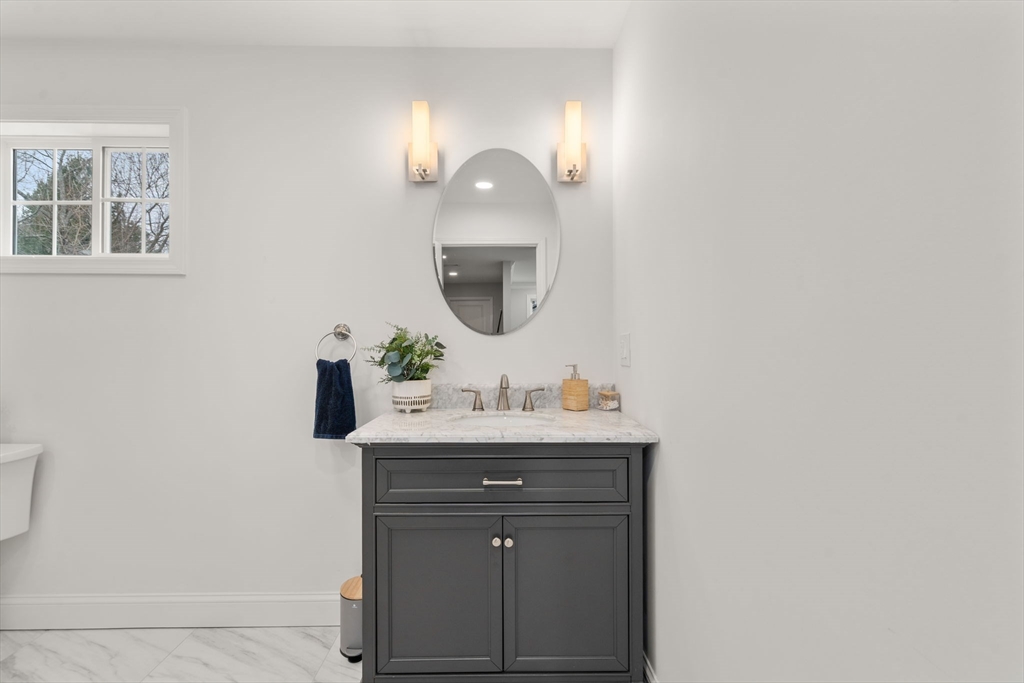 6 Ash Street Natick, MA 01760 - Photo 16 of 39 a bathroom with a sink vanity and a mirror