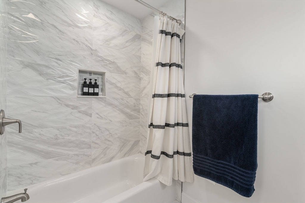 6 Ash Street Natick, MA 01760 - Photo 17 of 39 a bathroom with a shower