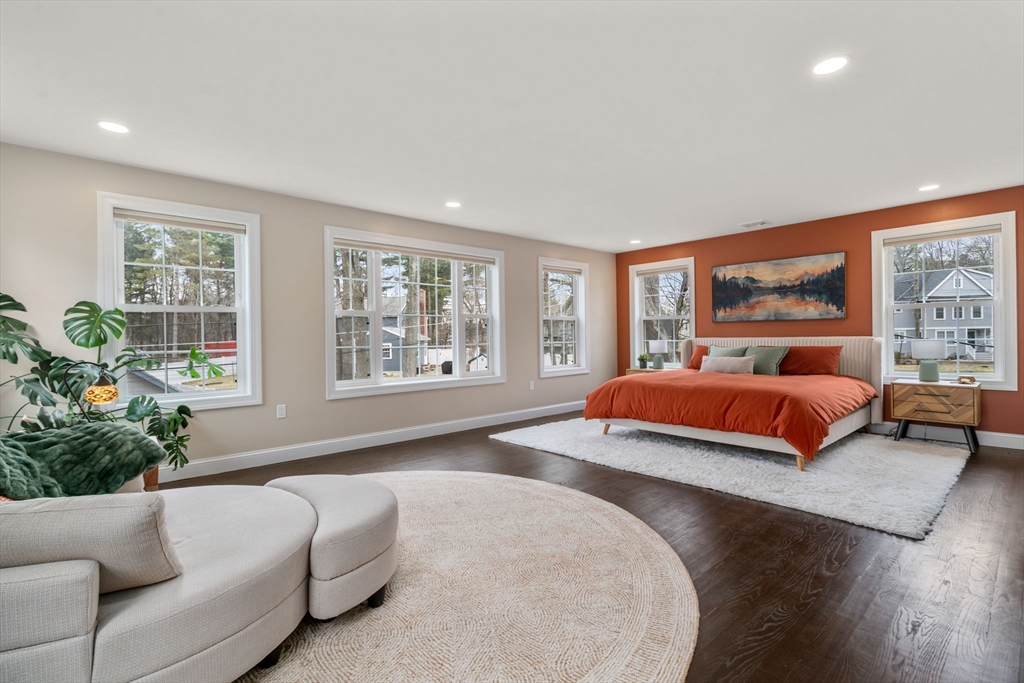 6 Ash Street Natick, MA 01760 - Photo 18 of 39 a bedroom with a large bed and a couch