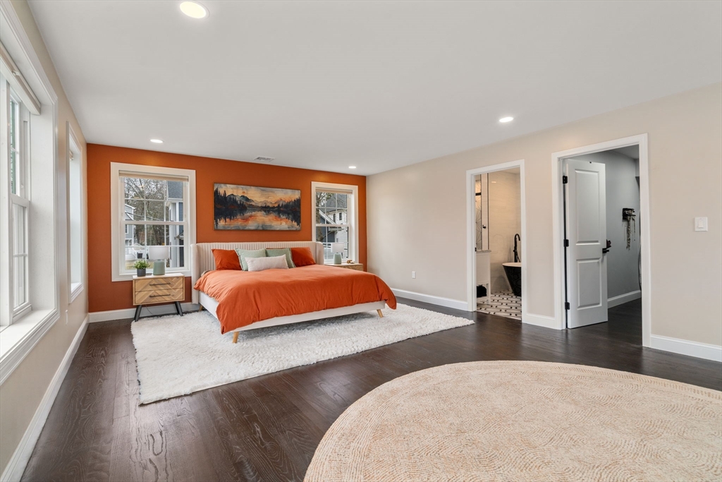 6 Ash Street Natick, MA 01760 - Photo 19 of 39 a bedroom with a large bed and a large window