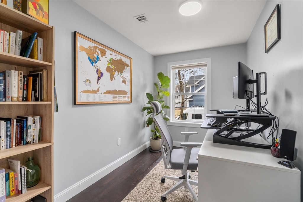 6 Ash Street Natick, MA 01760 - Photo 25 of 39 a workspace with furniture and a book shelf