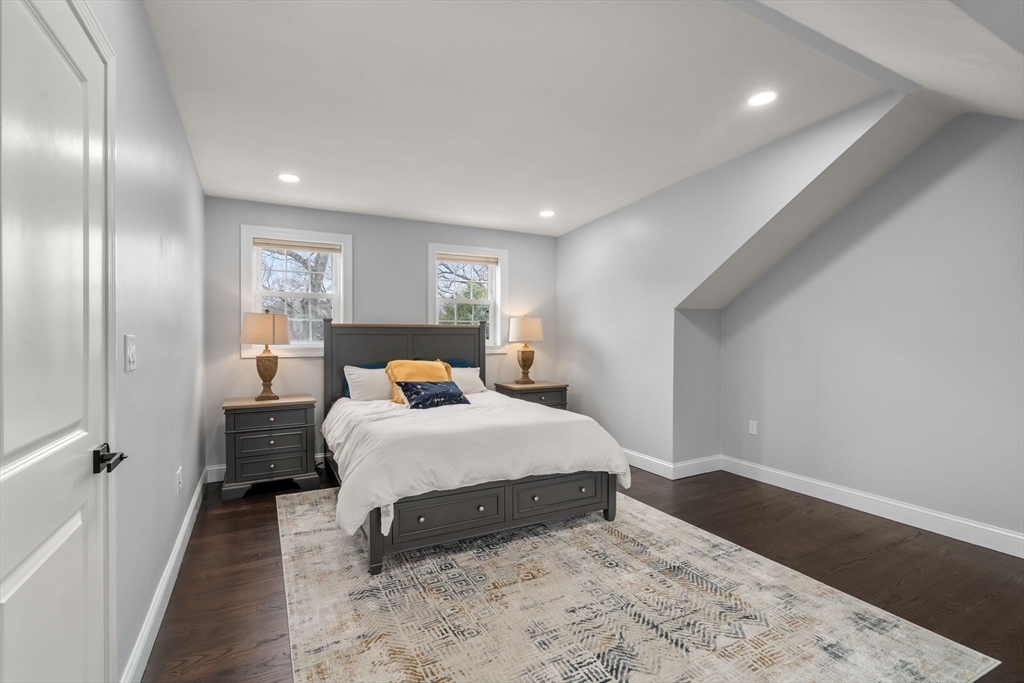 6 Ash Street Natick, MA 01760 - Photo 28 of 39 a bedroom with a bed and a walk in closet