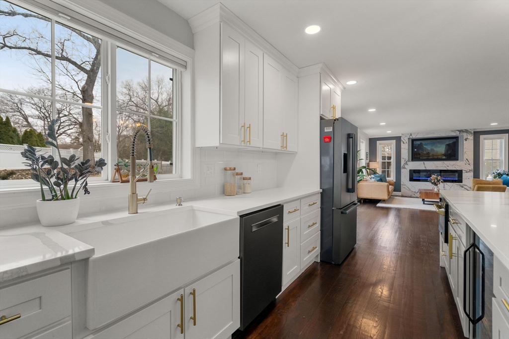 6 Ash Street Natick, MA 01760 - Photo 32 of 39 a kitchen with a sink stove and cabinets