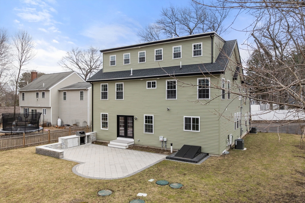 6 Ash Street Natick, MA 01760 - Photo 34 of 39 a front view of a house with garden