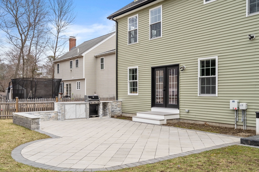 6 Ash Street Natick, MA 01760 - Photo 36 of 39 a view of a white house with large windows