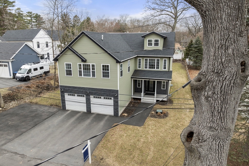 6 Ash Street Natick, MA 01760 - Photo 38 of 39 front view of a house with a yard