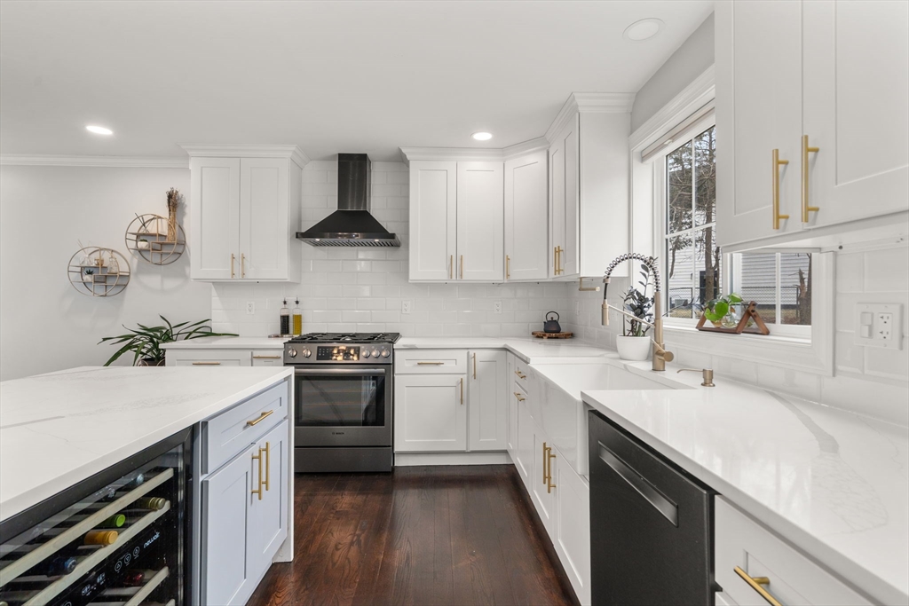 6 Ash Street Natick, MA 01760 - Photo 4 of 39 a kitchen with a sink stove and cabinets
