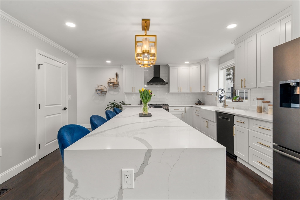 6 Ash Street Natick, MA 01760 - Photo 5 of 39 a kitchen that has a sink and a stove with white walls