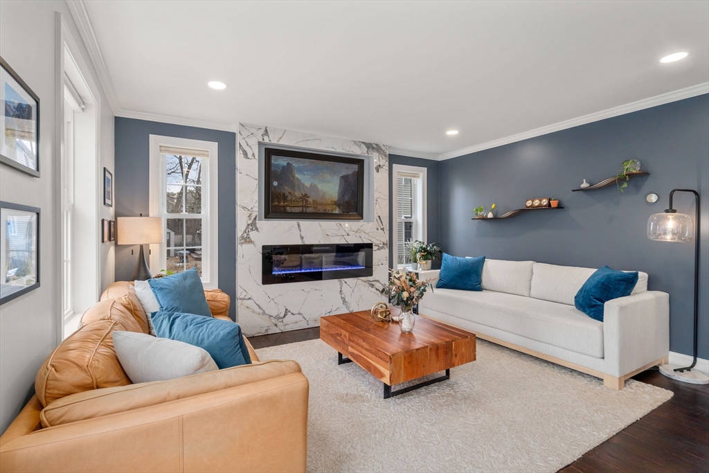 6 Ash Street Natick, MA 01760 - Photo 8 of 39 a living room with furniture and a flat screen tv