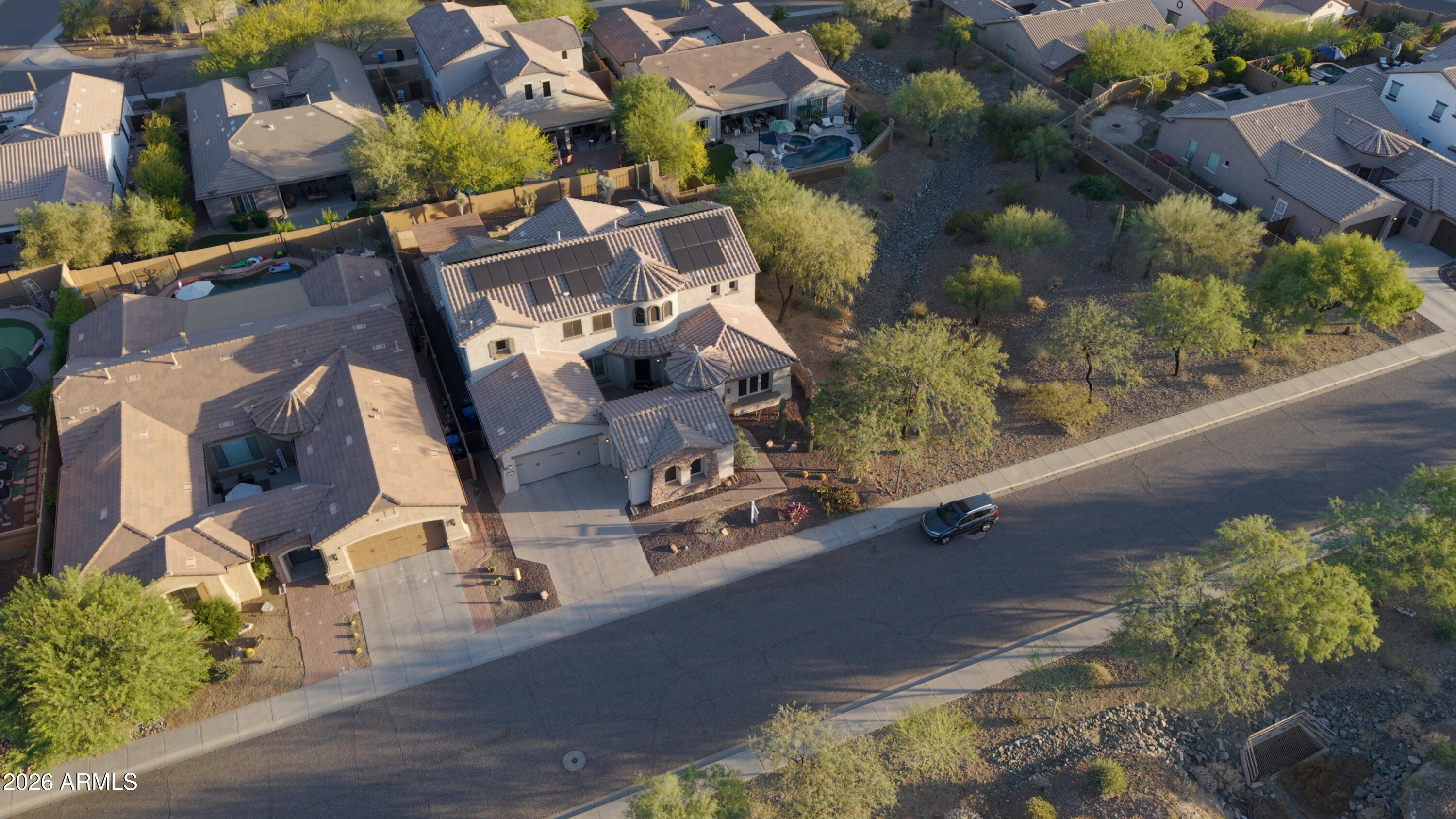 1615 West Red Fox Road Phoenix, AZ 85085 - Photo 60 of 64 an aerial view of residential houses with outdoor space