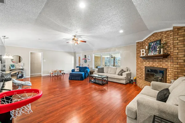a living room with furniture and a fireplace
