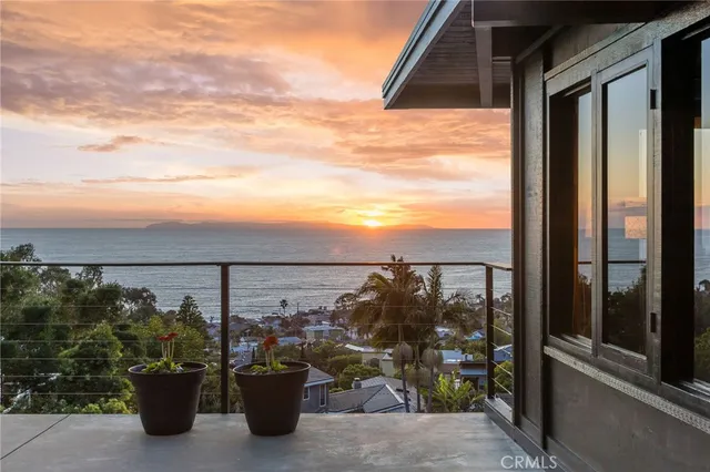 a view of a balcony with an ocean view