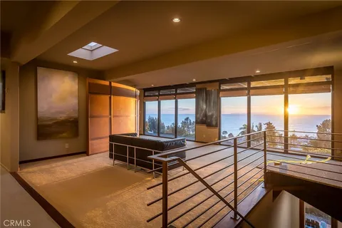a kitchen with stainless steel appliances granite countertop a sink and a stove
