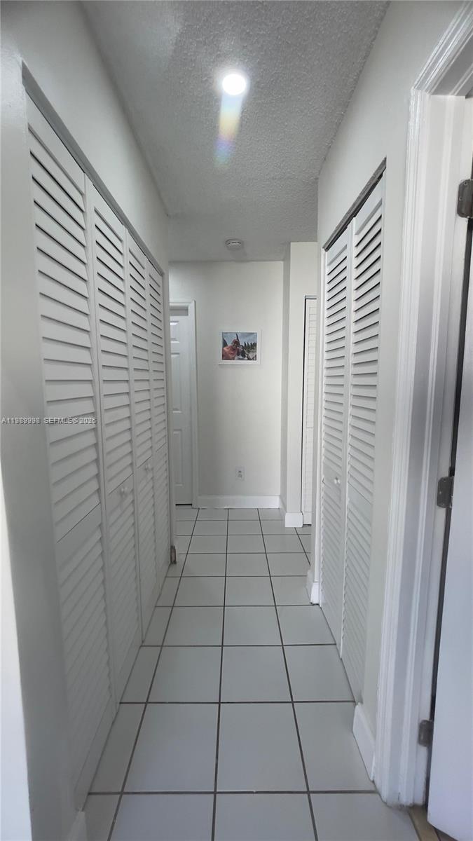 14252 Southwest 175th Terrace Miami, FL 33177 - Photo 16 of 39 a view of a livingroom with an empty space and a window