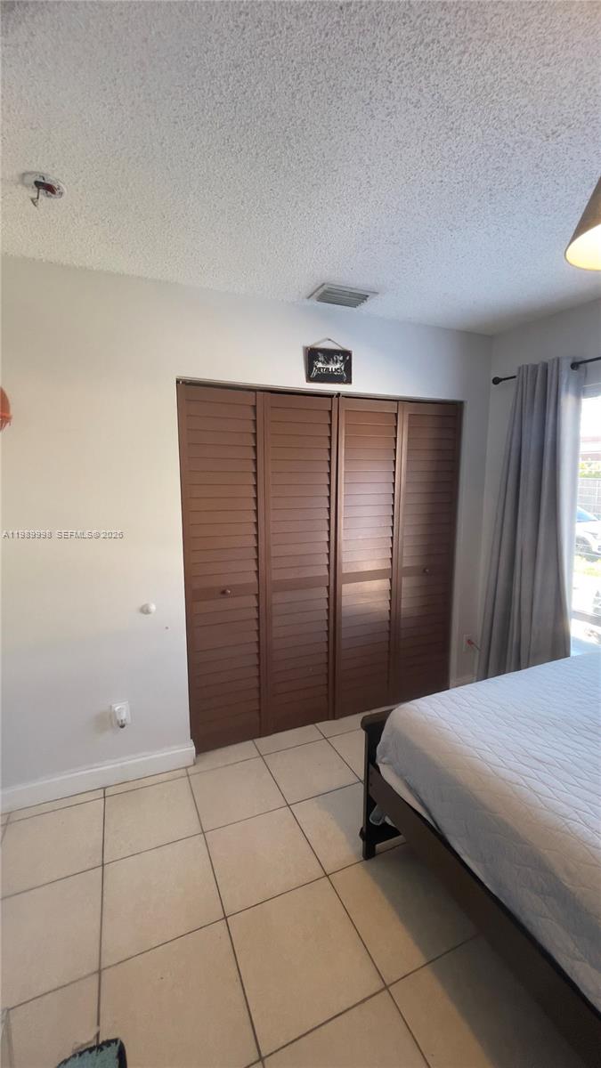 14252 Southwest 175th Terrace Miami, FL 33177 - Photo 21 of 39 a bedroom with a bed and a shower