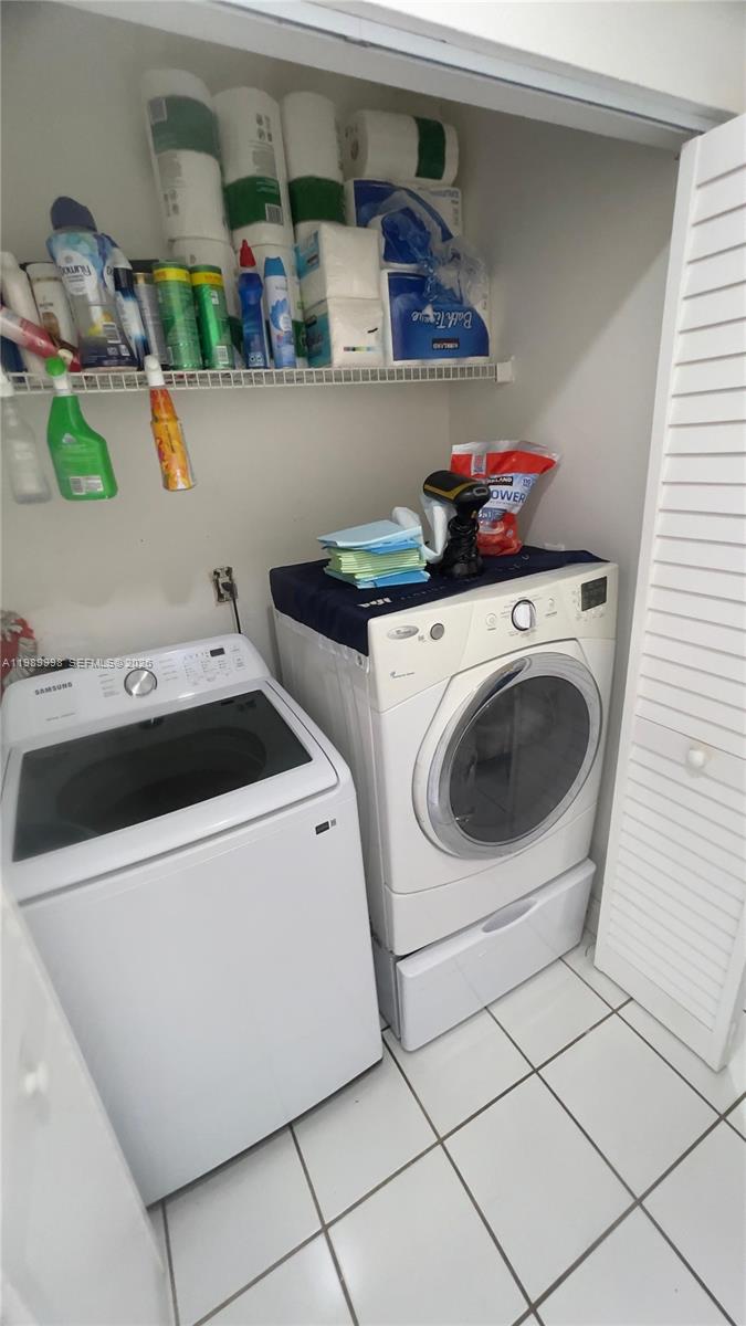 14252 Southwest 175th Terrace Miami, FL 33177 - Photo 22 of 39 a utility room with dryer and washer