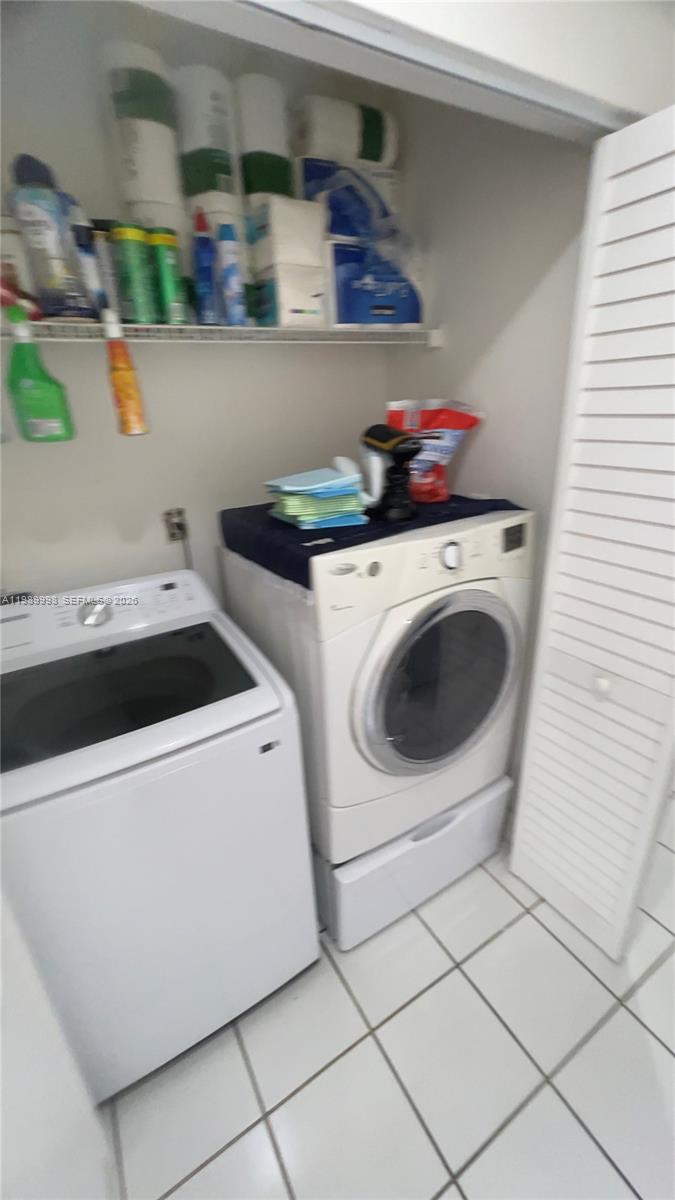 14252 Southwest 175th Terrace Miami, FL 33177 - Photo 24 of 39 a utility room with dryer and washer