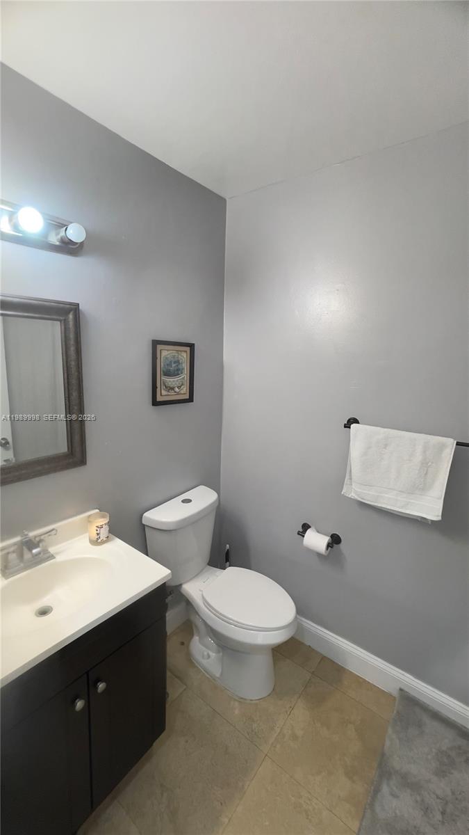 14252 Southwest 175th Terrace Miami, FL 33177 - Photo 29 of 39 a bathroom with a toilet sink and mirror