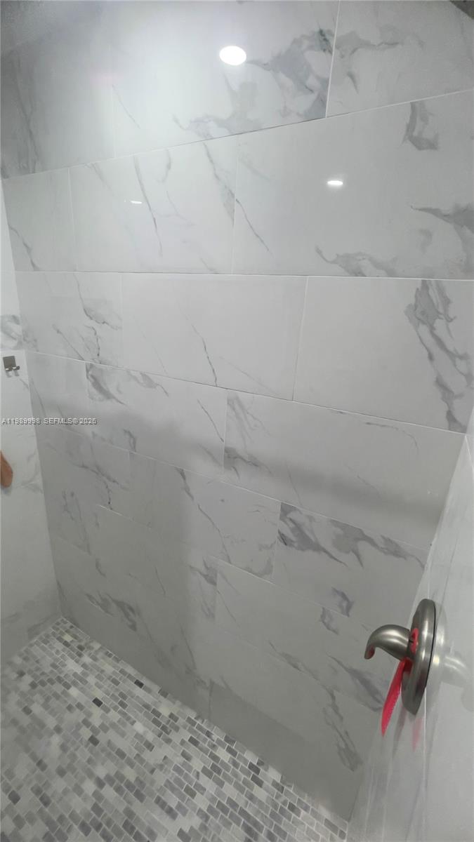 14252 Southwest 175th Terrace Miami, FL 33177 - Photo 30 of 39 a bathroom with a shower