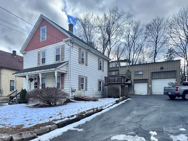 a view of a car park in front of house