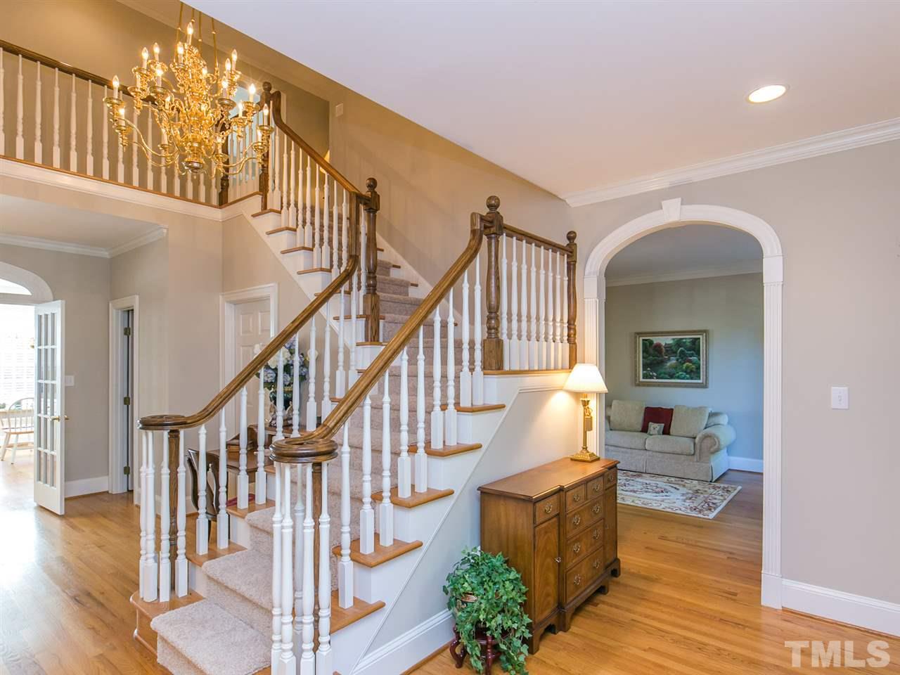 1604 Adams Mountain Road Raleigh, NC 27614 - Photo 3 of 25 View of stairs from the foyer. Notice the lovely arched doorway to the living room.