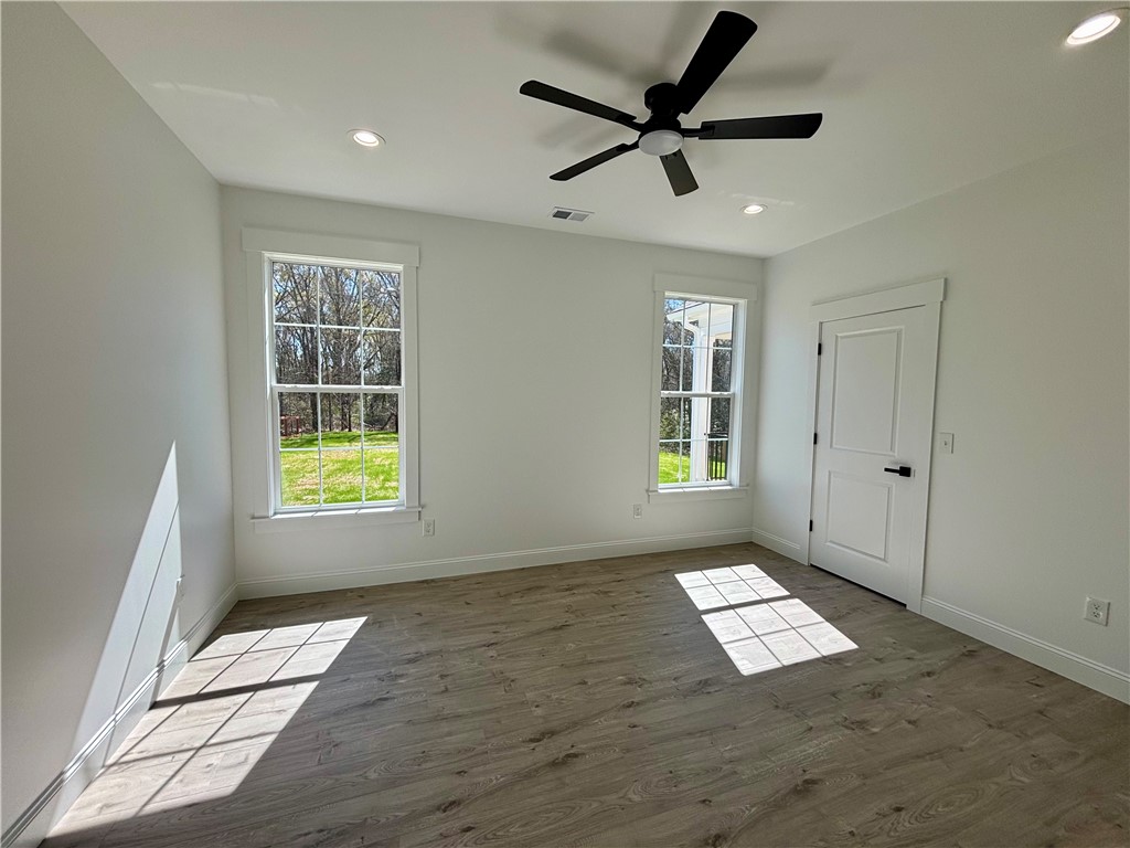 26 B Fisher Jenkins Road Anderson, SC 29625 - Photo 12 of 24 This airy room offers ample natural light and a comforting overhead fan.