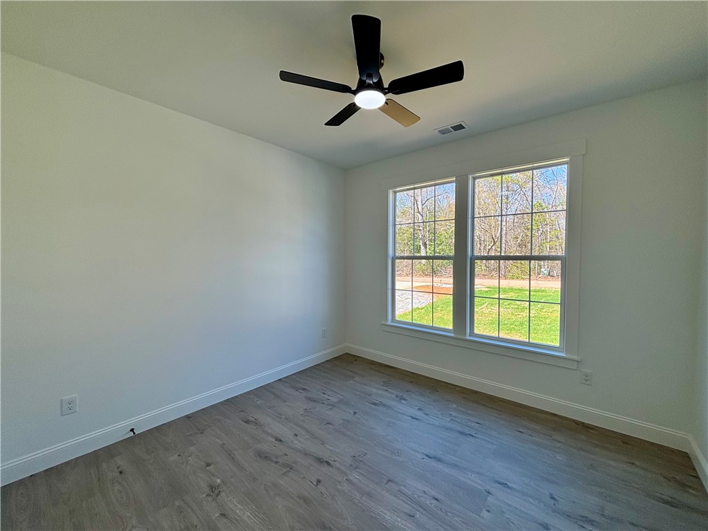26 B Fisher Jenkins Road Anderson, SC 29625 - Photo 13 of 24 This bright room features a large window, offering a refreshing view of the outdoors.