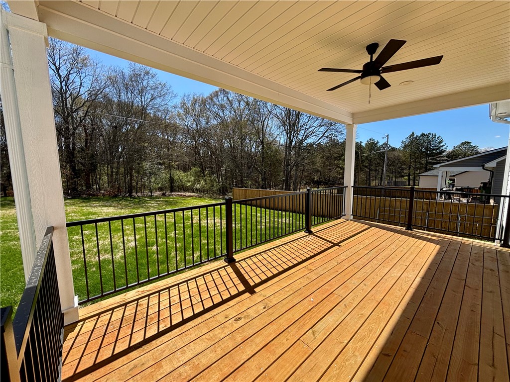 26 B Fisher Jenkins Road Anderson, SC 29625 - Photo 18 of 24 This spacious covered deck offers serene views and a refreshing breeze.