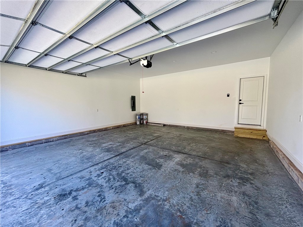 26 B Fisher Jenkins Road Anderson, SC 29625 - Photo 20 of 24 This spacious garage offers ample room and direct access to the interior of the home.