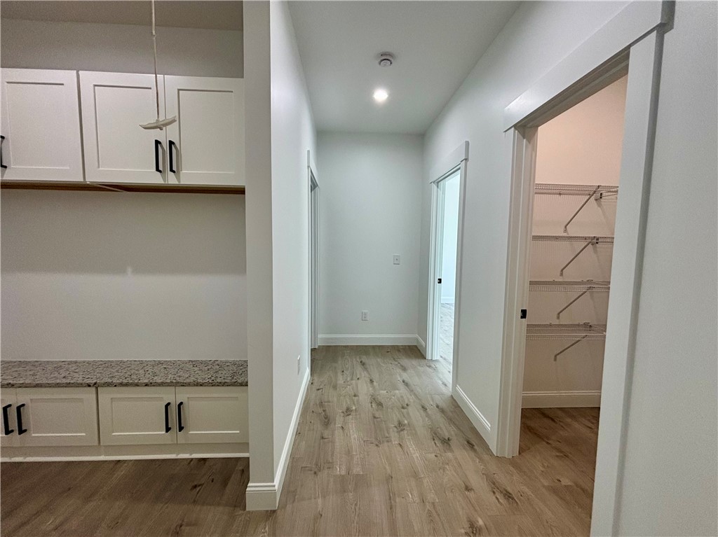 26 B Fisher Jenkins Road Anderson, SC 29625 - Photo 23 of 24 This spacious hallway offers generous storage solutions and leads to additional rooms.