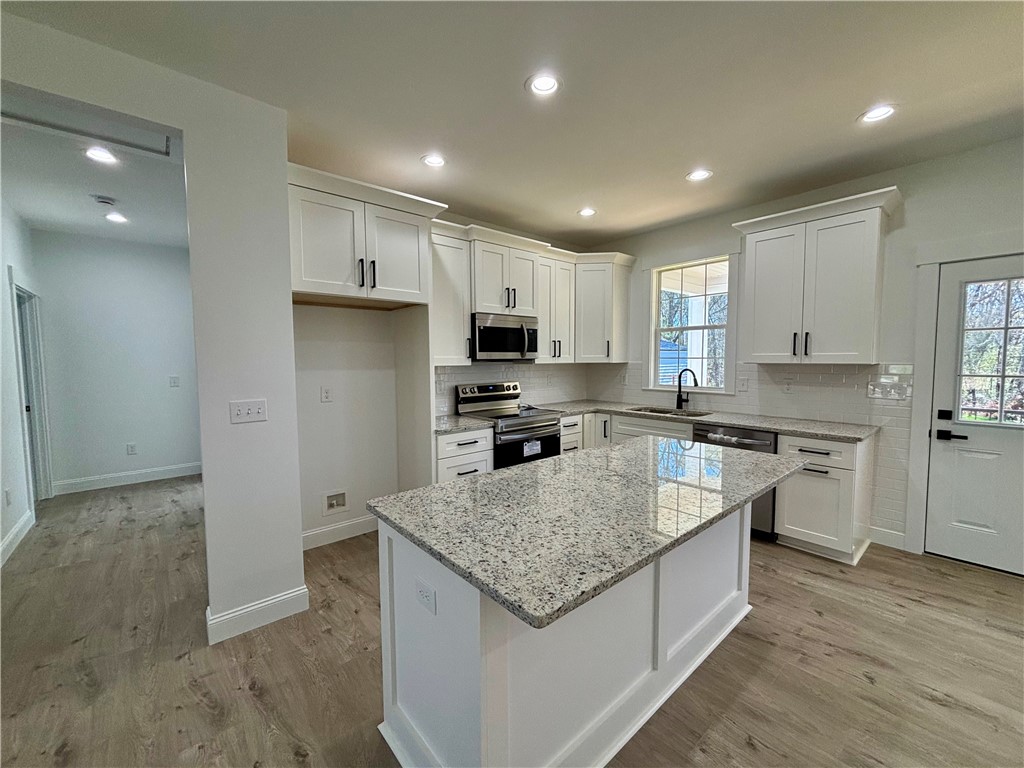 26 B Fisher Jenkins Road Anderson, SC 29625 - Photo 4 of 24 This newly renovated kitchen features sleek appliances and ample counter space, perfect for culinary endeavors.