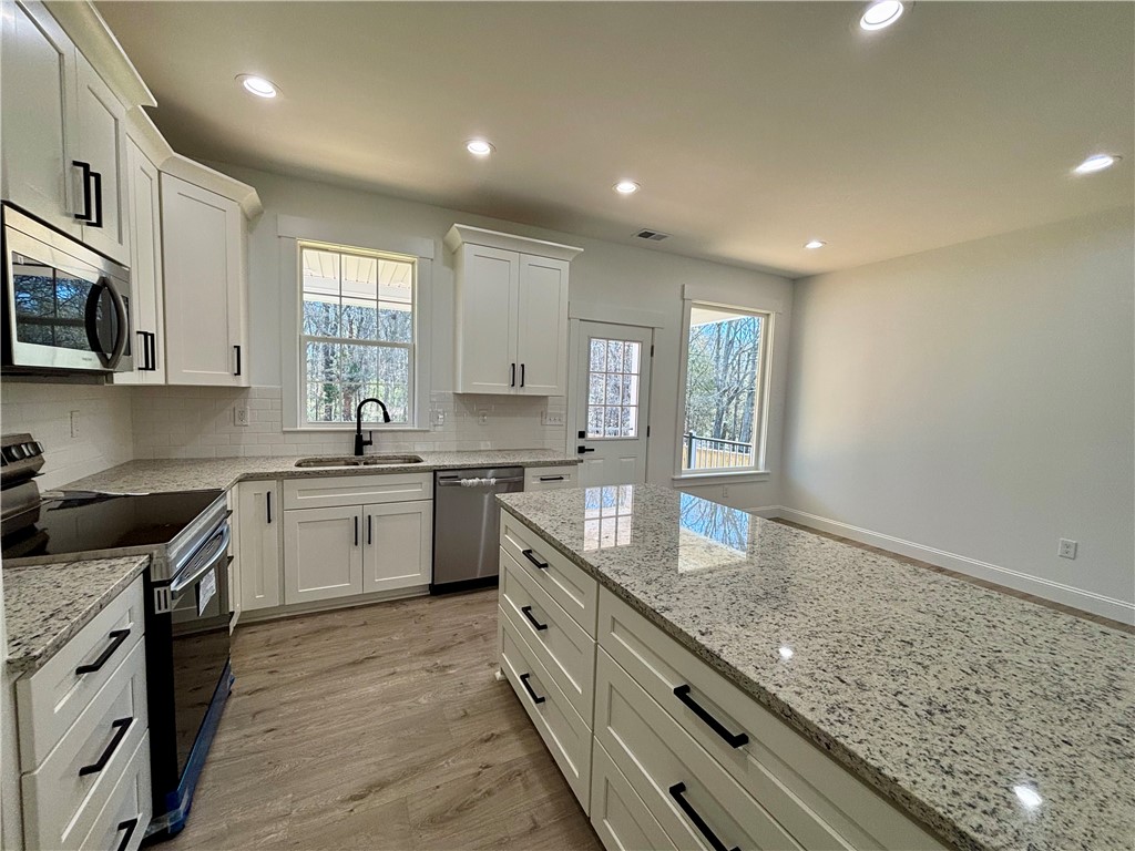 26 B Fisher Jenkins Road Anderson, SC 29625 - Photo 6 of 24 Bright and open, this kitchen boasts sleek counters and modern appliances, perfect for everyday living.
