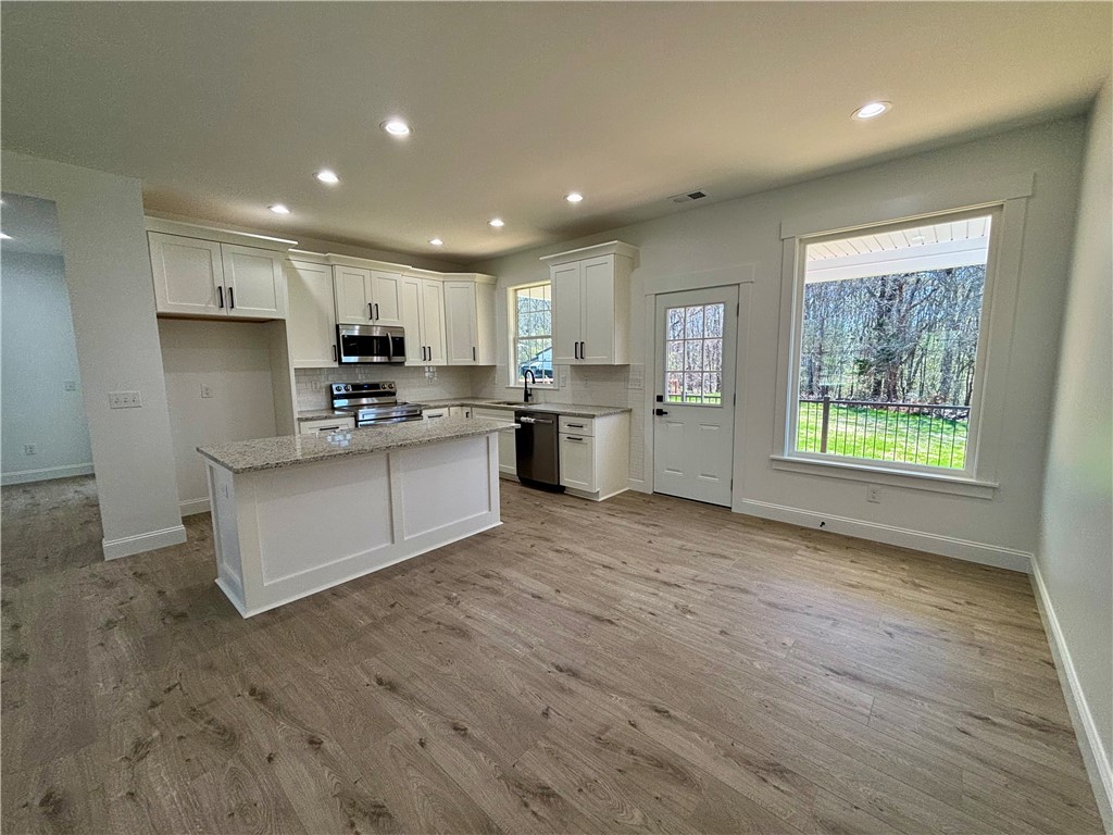 26 B Fisher Jenkins Road Anderson, SC 29625 - Photo 8 of 24 This spacious kitchen offers a seamless flow, ideal for culinary creations and entertaining.