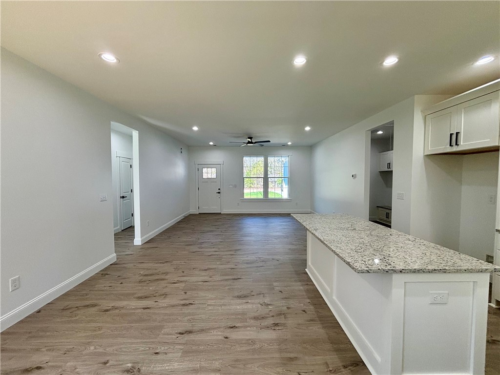 26 B Fisher Jenkins Road Anderson, SC 29625 - Photo 10 of 24 This inviting space features an open layout, ideal for modern living and entertaining.