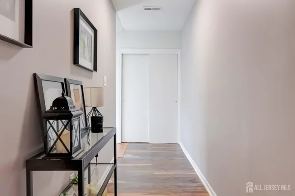 a view of a hallway with furniture and entryway