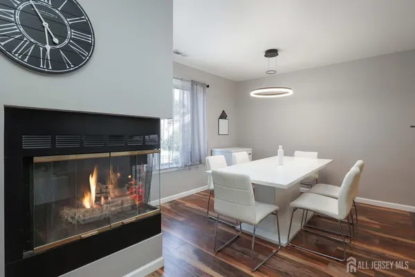 a dining room with furniture and a fireplace