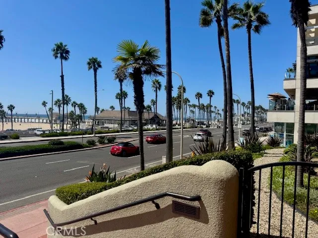 a view of balcony with two chairs and a rug