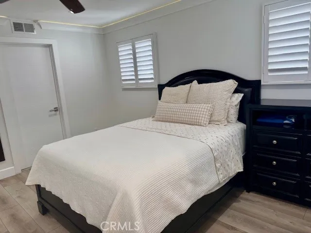 a bathroom with a shower and a glass door