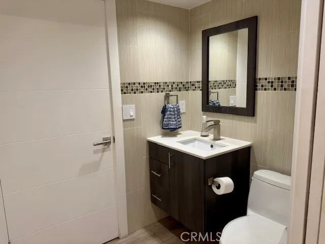 a kitchen with kitchen island a counter appliances and cabinets