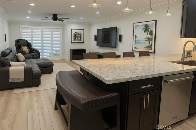a kitchen with a table chairs refrigerator and microwave
