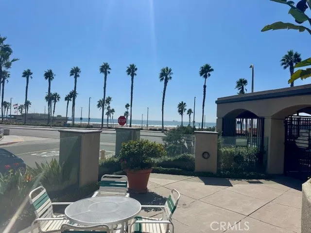 a view of a chairs and table in patio
