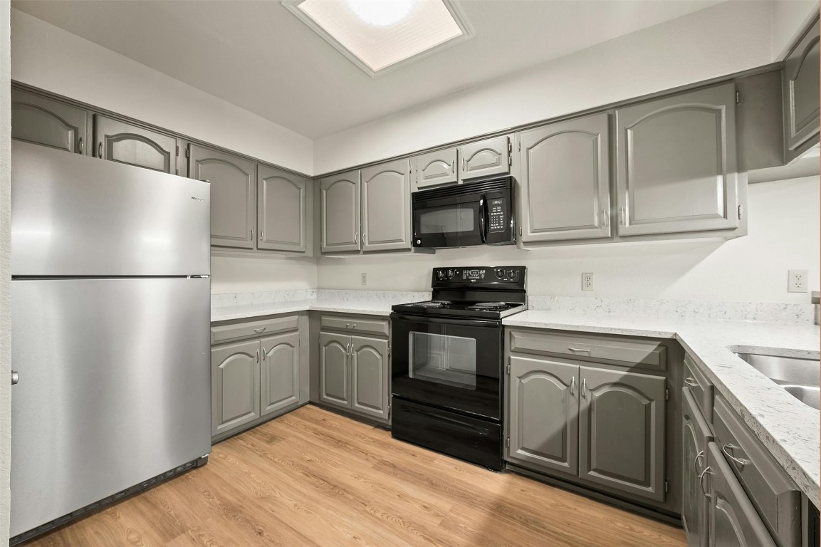 1910 Robbins Place, Unit 105 Austin, TX 78705 - Photo 14 of 30 Wide kitchen view with generous cabinetry