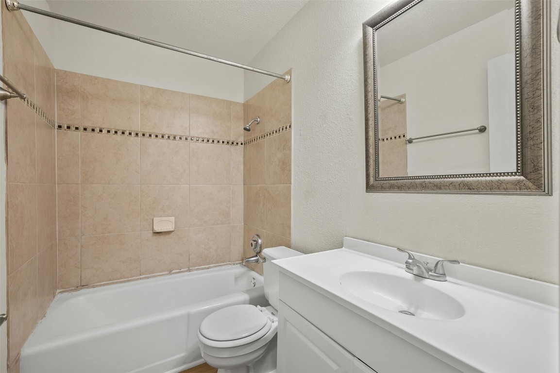 1910 Robbins Place, Unit 105 Austin, TX 78705 - Photo 20 of 30 Full bathroom with clean finishes and a bright vanity area