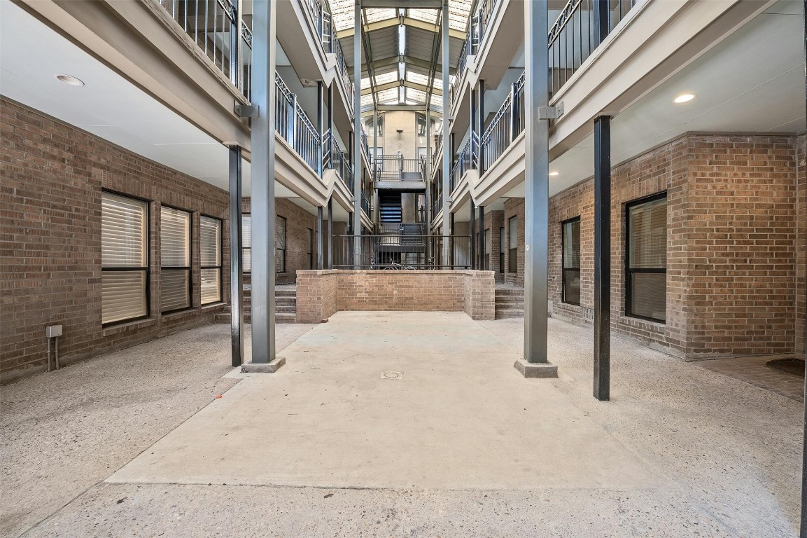 1910 Robbins Place, Unit 105 Austin, TX 78705 - Photo 4 of 30 Exterior approach with covered access and courtyard vibe