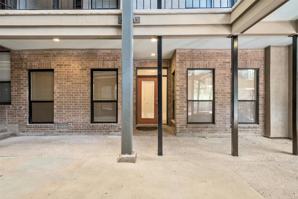 1910 Robbins Place, Unit 105 Austin, TX 78705 - Photo 5 of 30 Exterior approach with covered access and courtyard vibe