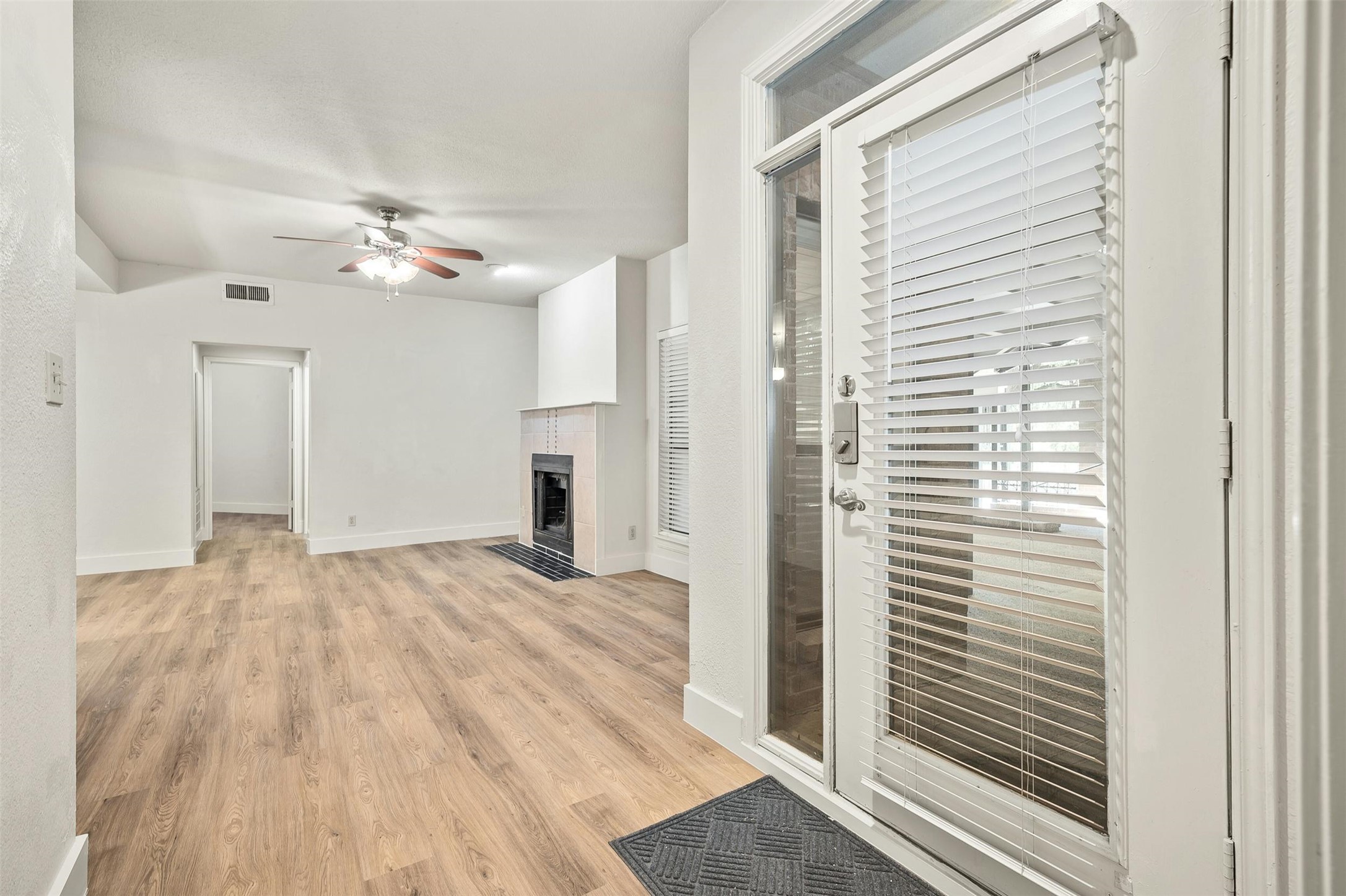 1910 Robbins Place, Unit 105 Austin, TX 78705 - Photo 6 of 30 Entry foyer with plank flooring and high ceilings