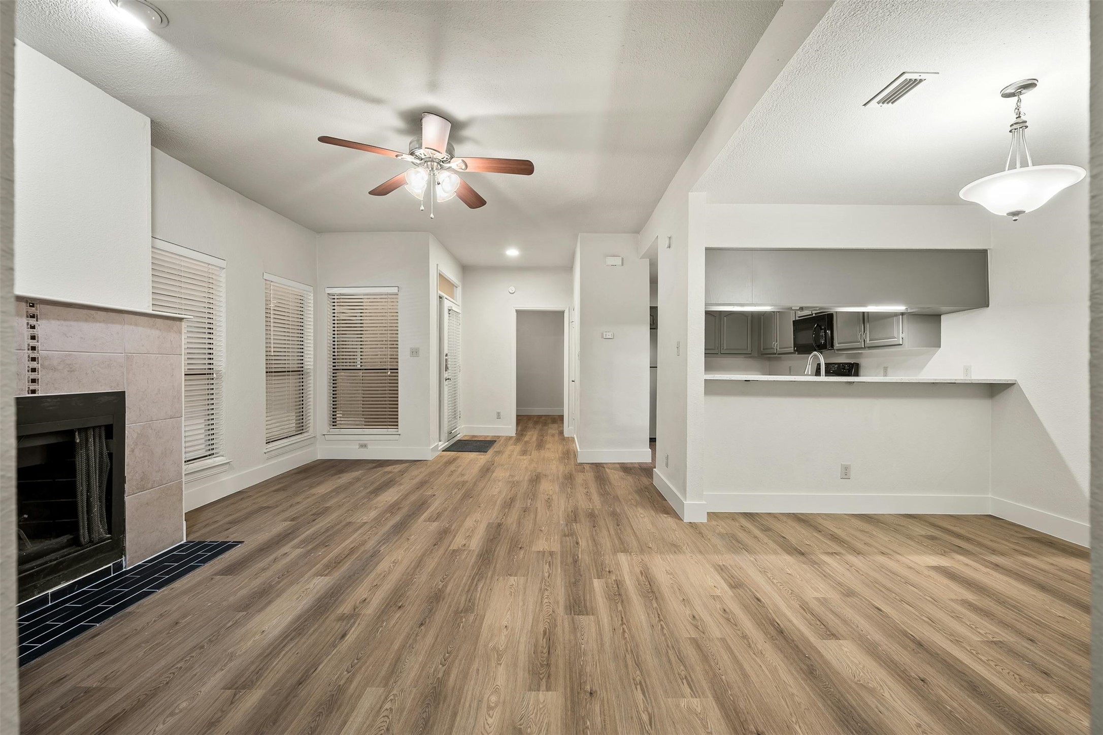 1910 Robbins Place, Unit 105 Austin, TX 78705 - Photo 8 of 30 Alternate view of living/dining with natural light
