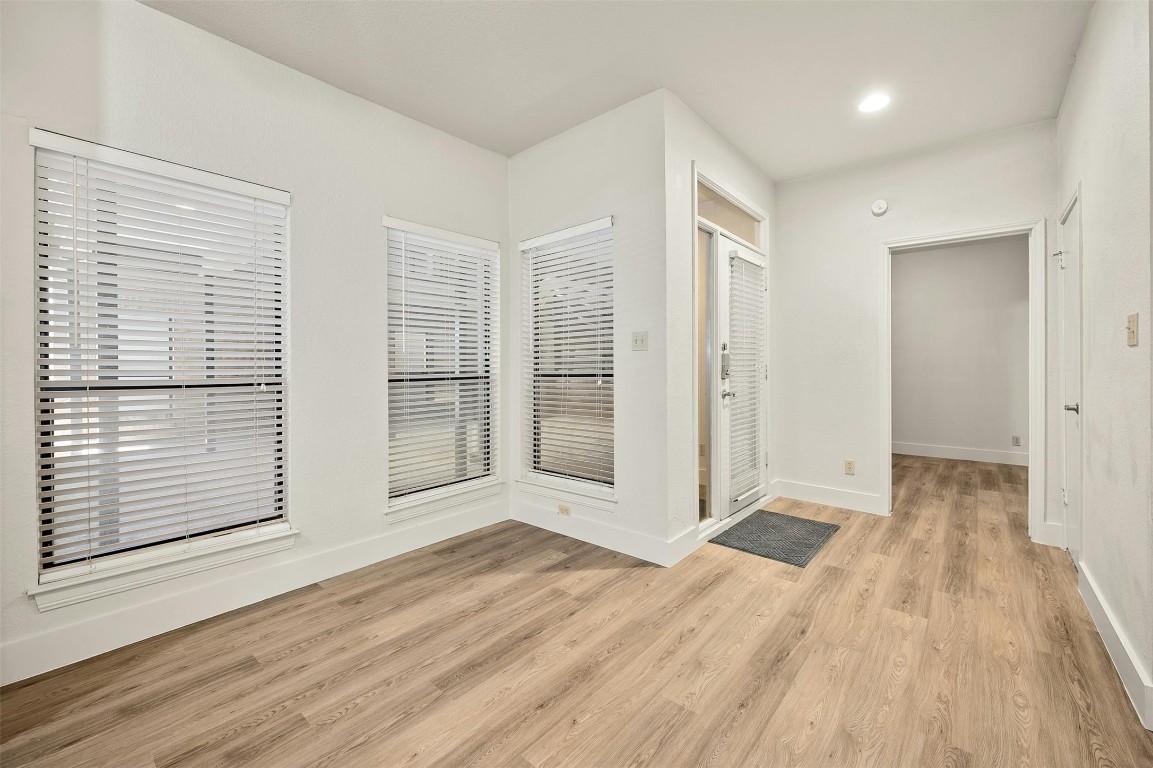 1910 Robbins Place, Unit 105 Austin, TX 78705 - Photo 9 of 30 2nd Angle, Entry foyer with plank flooring and high ceilings