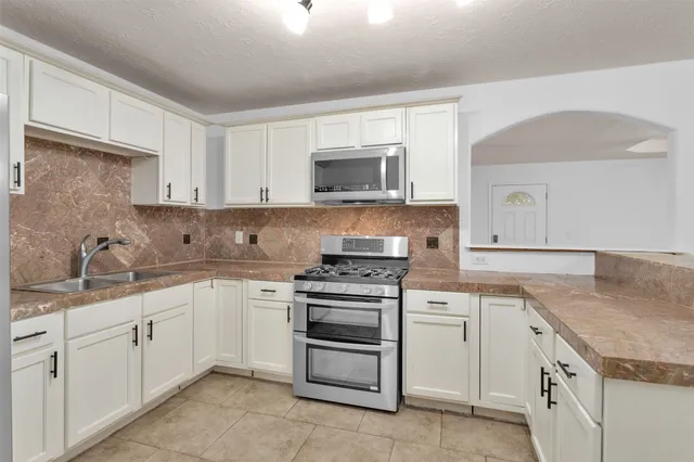 a bathroom with a sink and a shower